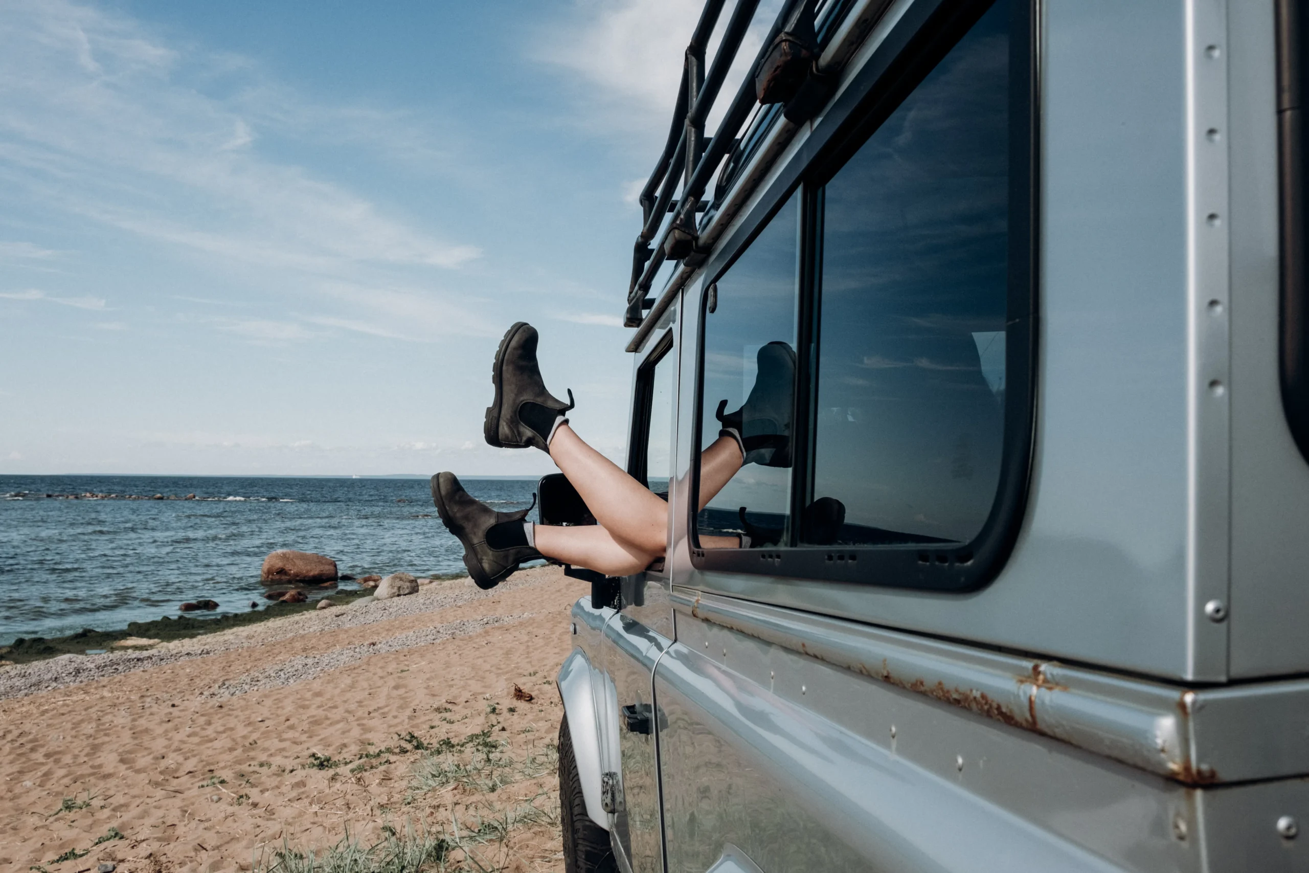 A woman confidently walking on a beach, showcasing her smooth legs and embodying the freedom and confidence that comes with it.