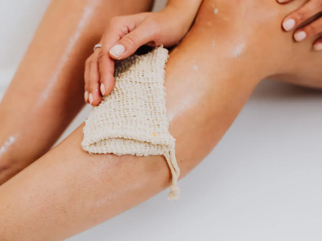 Close-up of smooth legs after waxing — Alt text: Flawlessly smooth women's legs showcasing professional waxing results