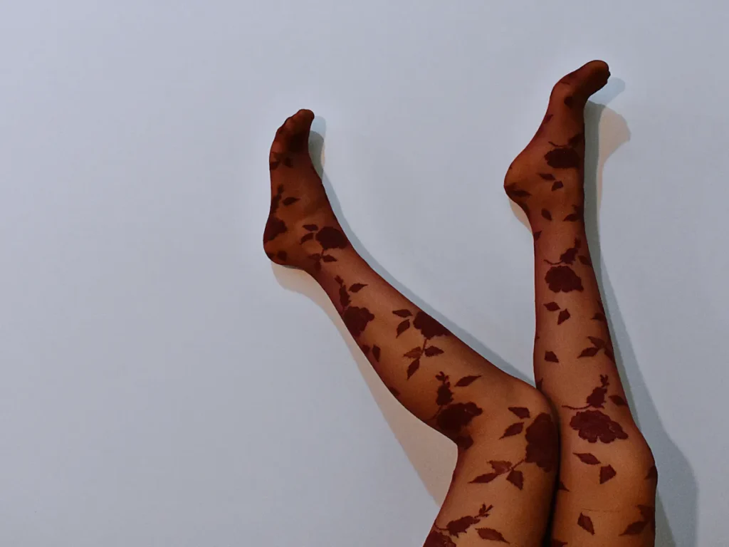 A close-up of flawlessly smooth legs after waxing, showcasing a radiant and hair-free appearance.