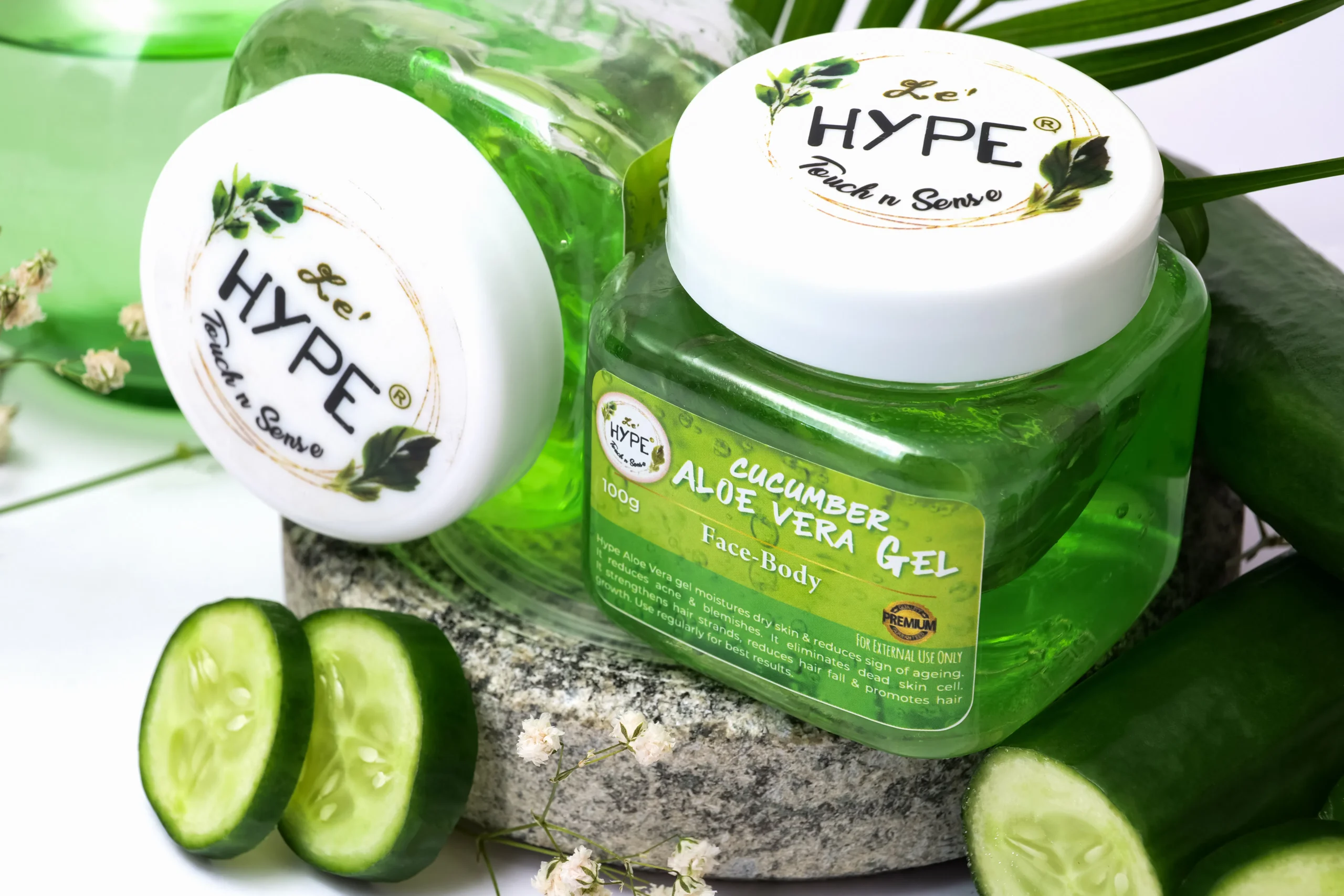 Product shot of Le't Hype Cucumber Aloe Vera Gel, a skincare product in a clear jar with fresh cucumbers, promoting its natural and soothing properties.