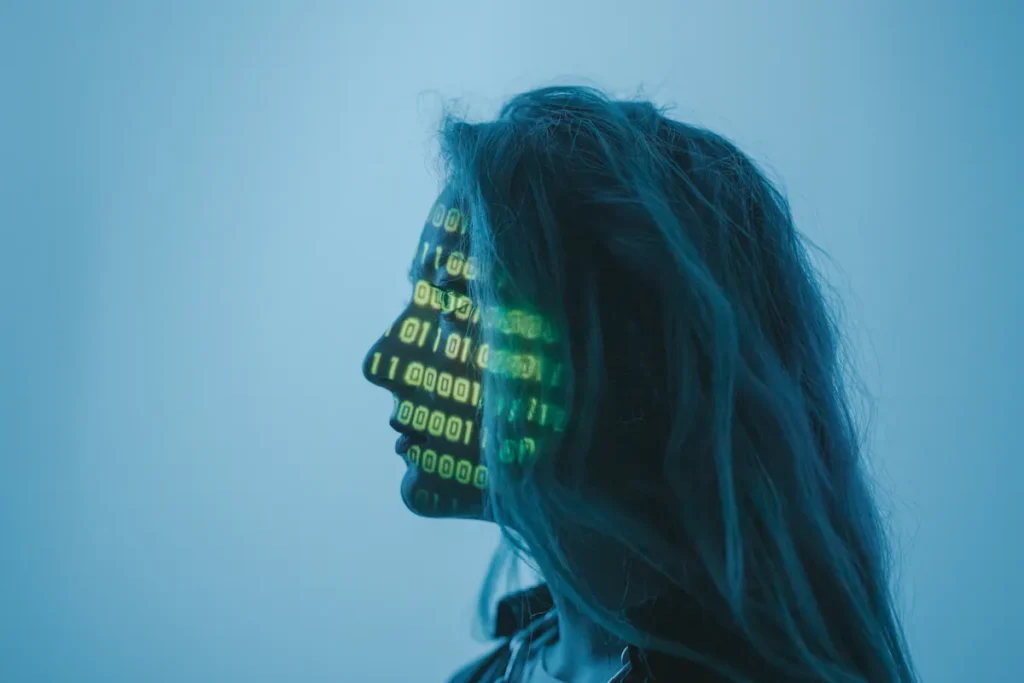 Woman's profile with binary code projected, conceptual data visualization