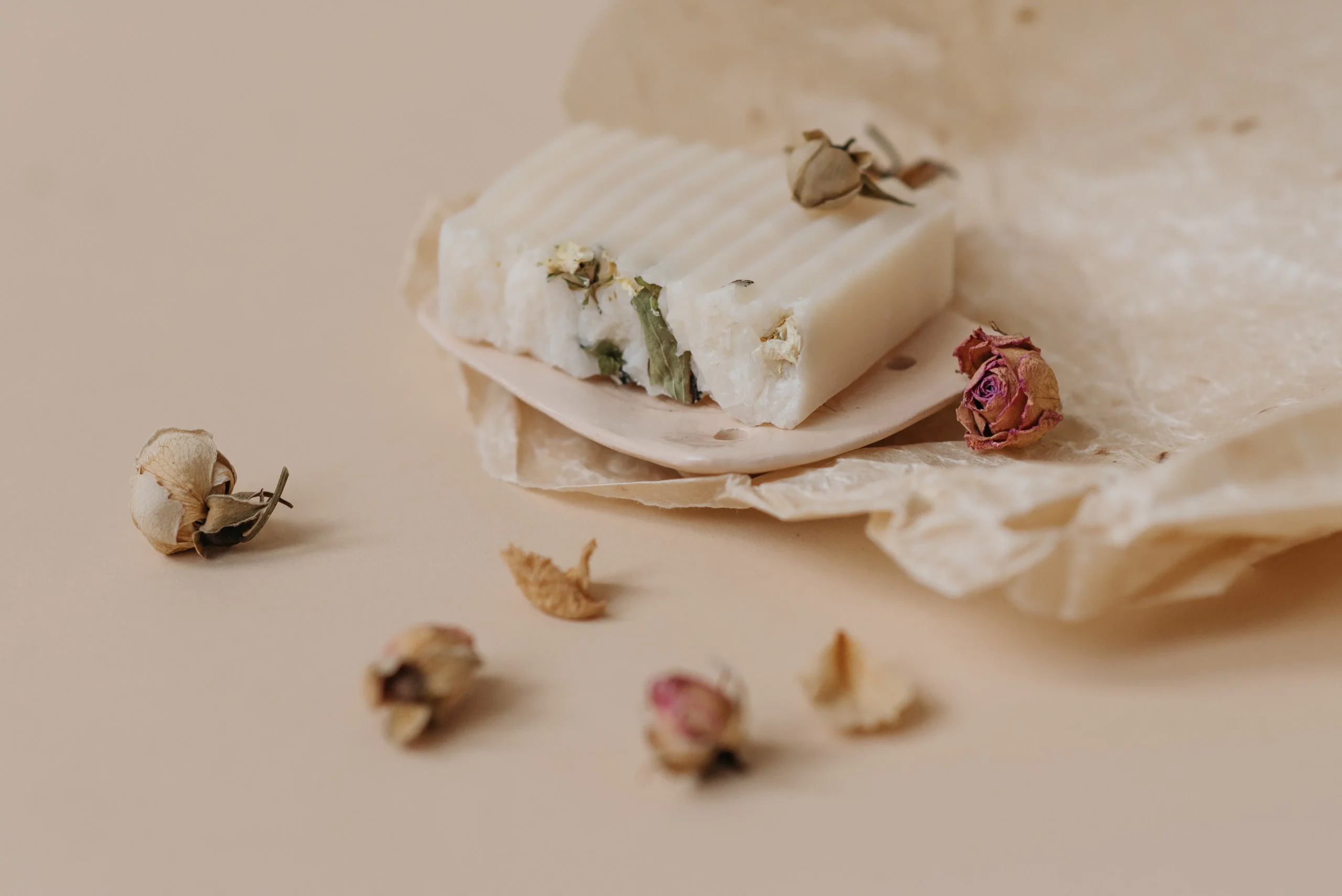 Close-up of a bar of soap decorated with dried flowers. This image is not relevant to the provided context.
