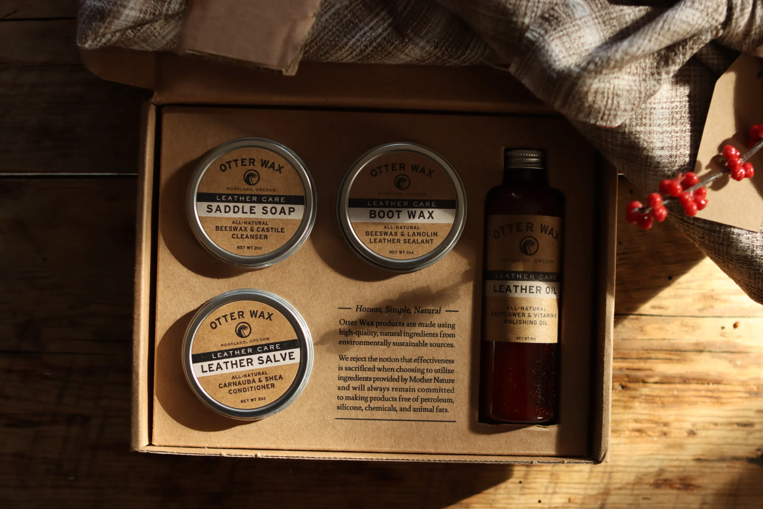 Otter Wax leather care kit with saddle soap, boot wax, leather salve, and leather oil.