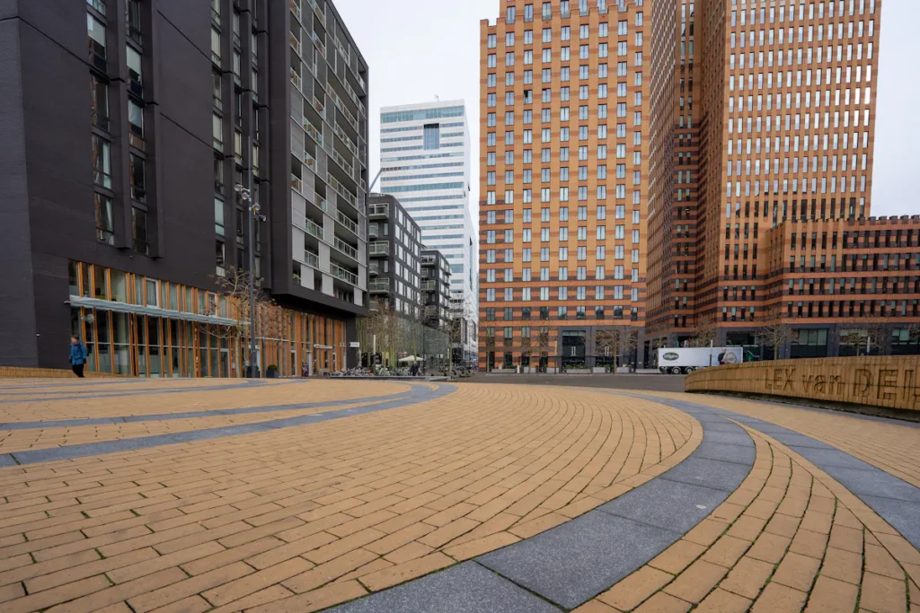 Modern architecture and brick walkway in Amsterdam, Netherlands.