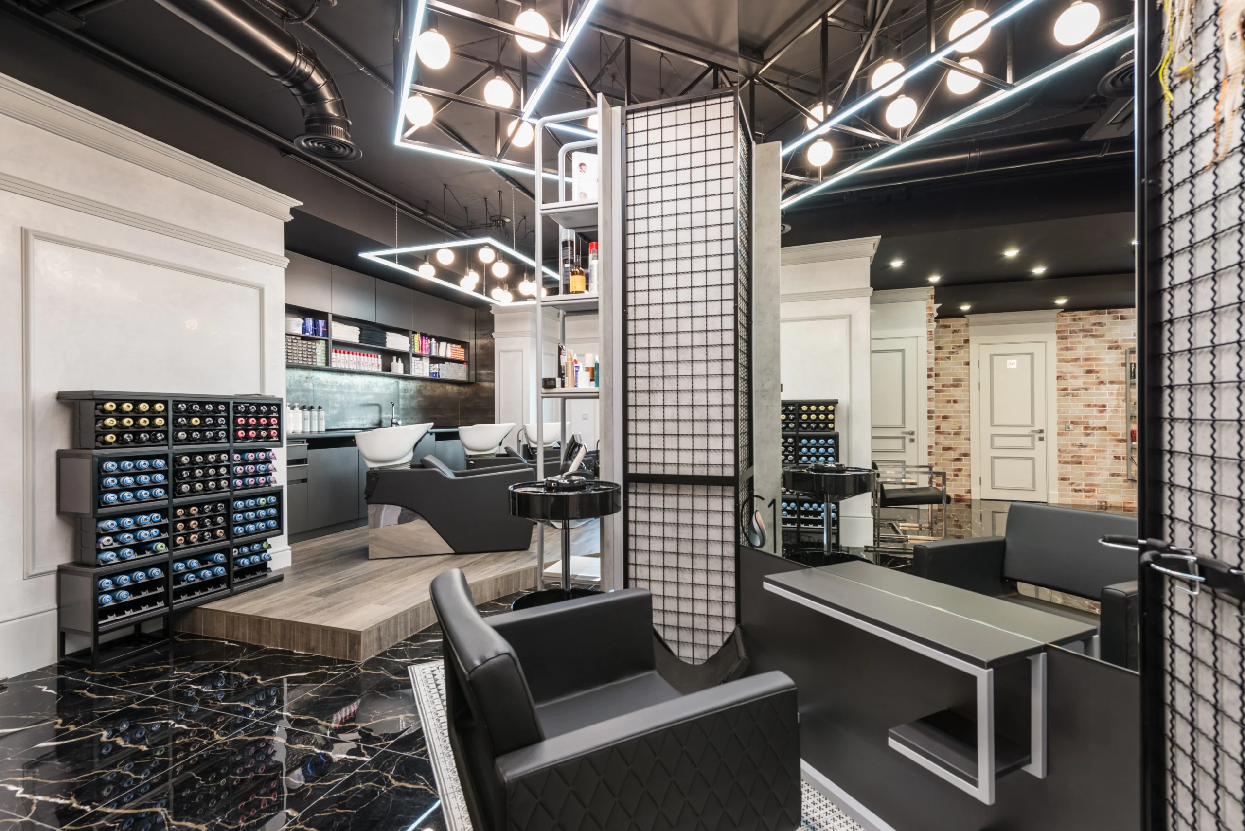 Interior of a modern Amsterdam beauty salon with black and white decor.
