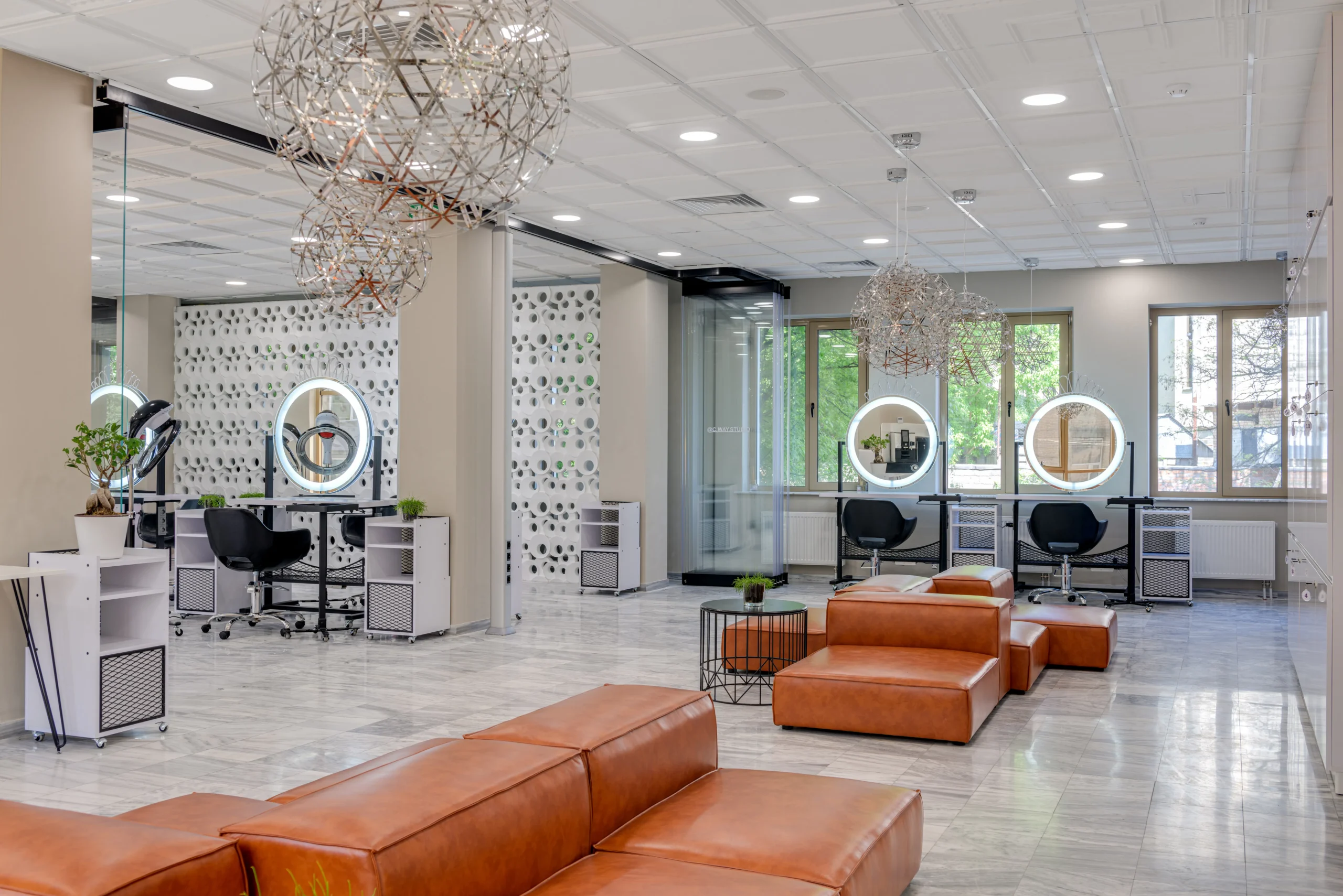 Interior of an Amsterdam beauty salon with leather seating and styling stations
