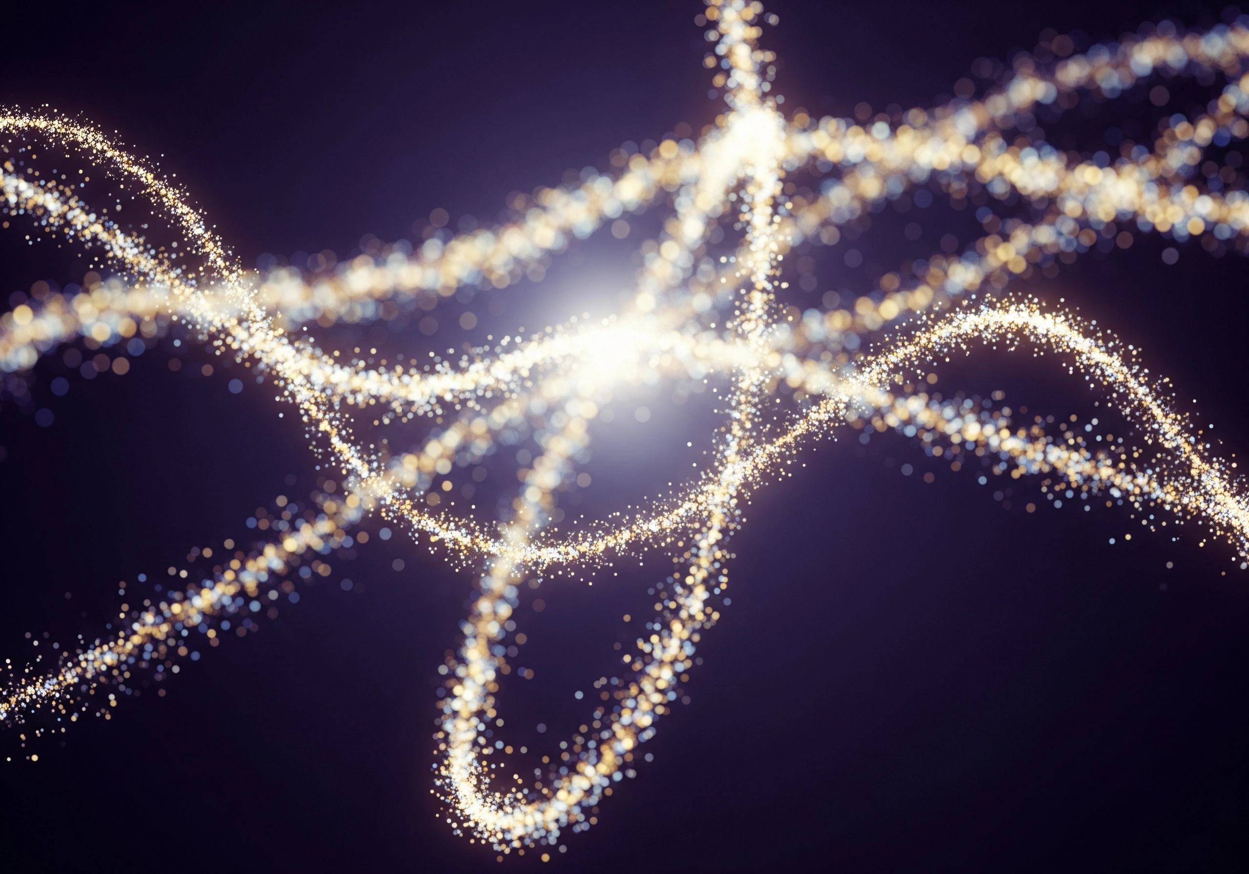 Abstract image of swirling golden light particles on a dark background.