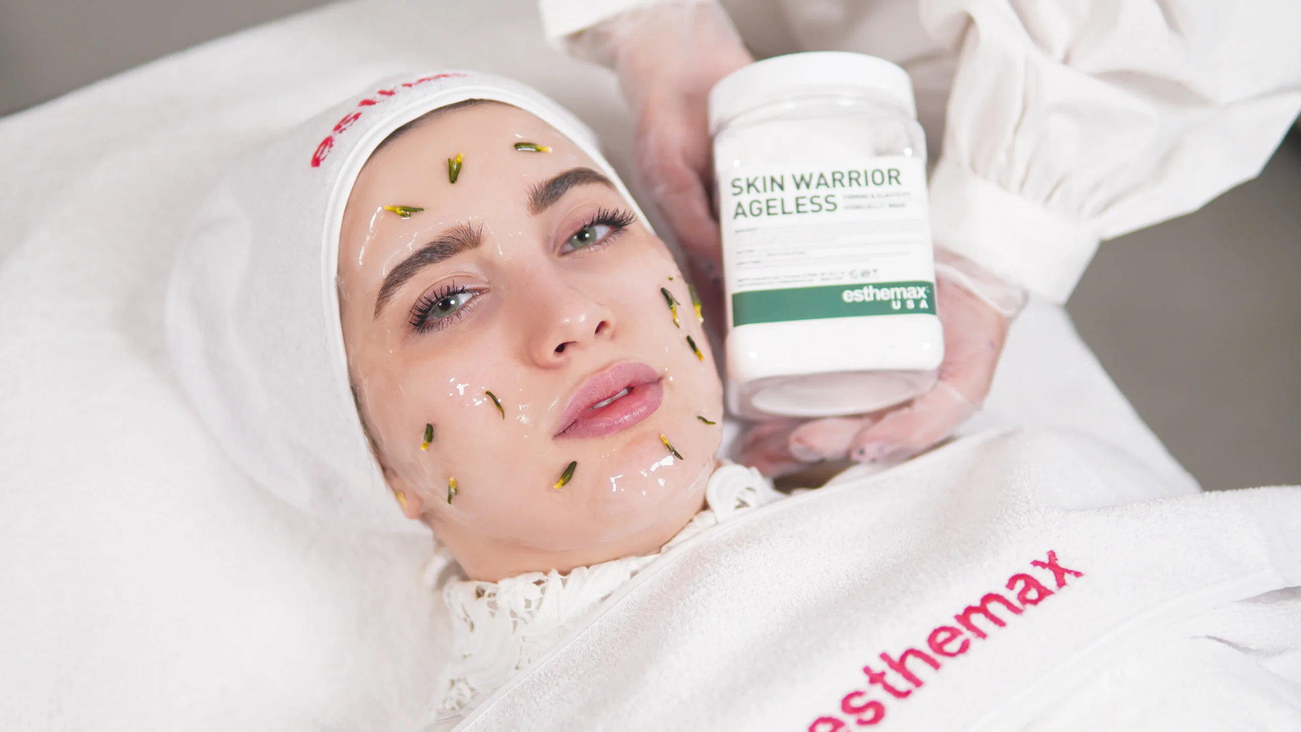 Woman receiving 'Skin Warrior Ageless' facial at a beauty salon in Amsterdam.