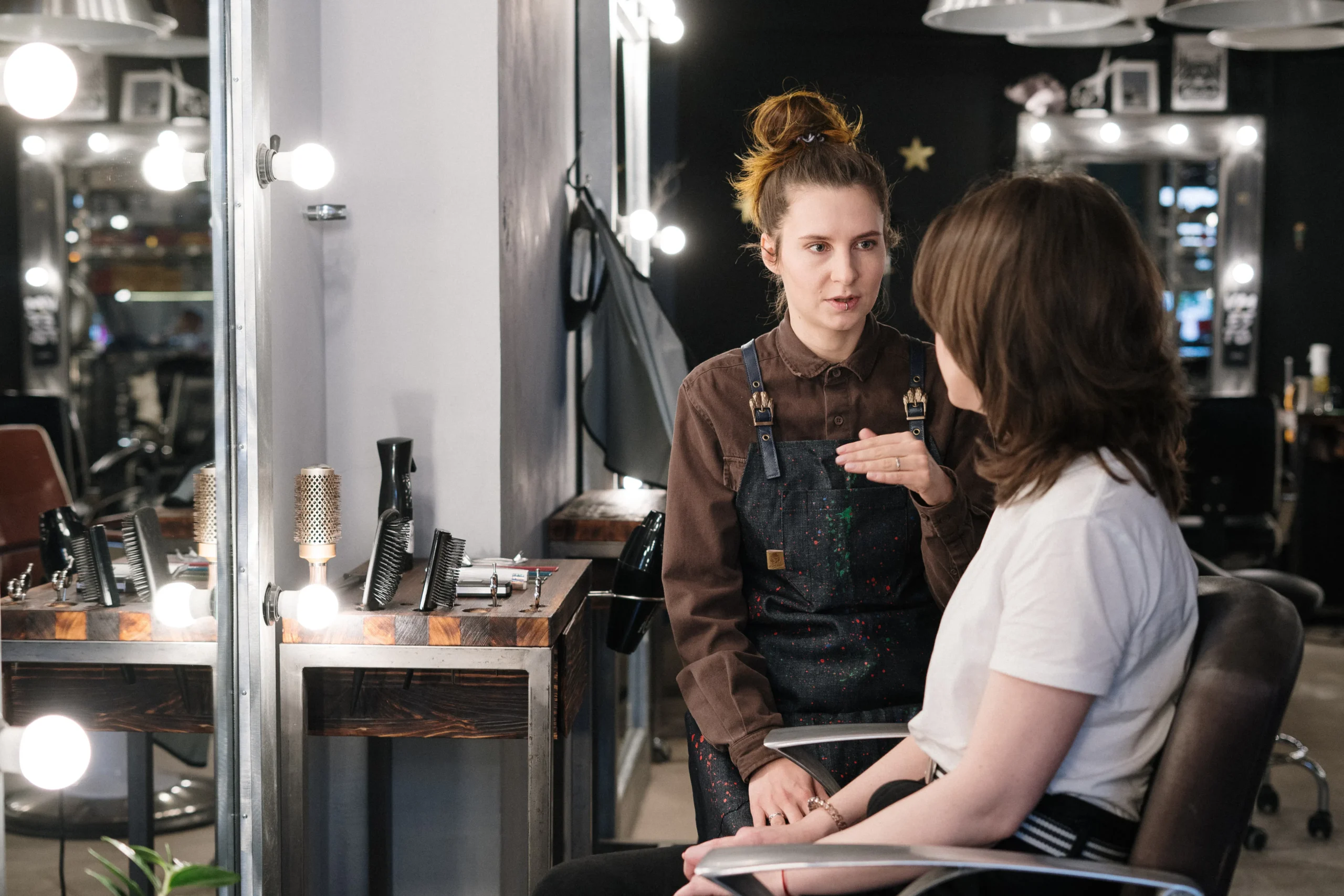 Beautician in Amsterdam consulting with a client at a beauty salon.