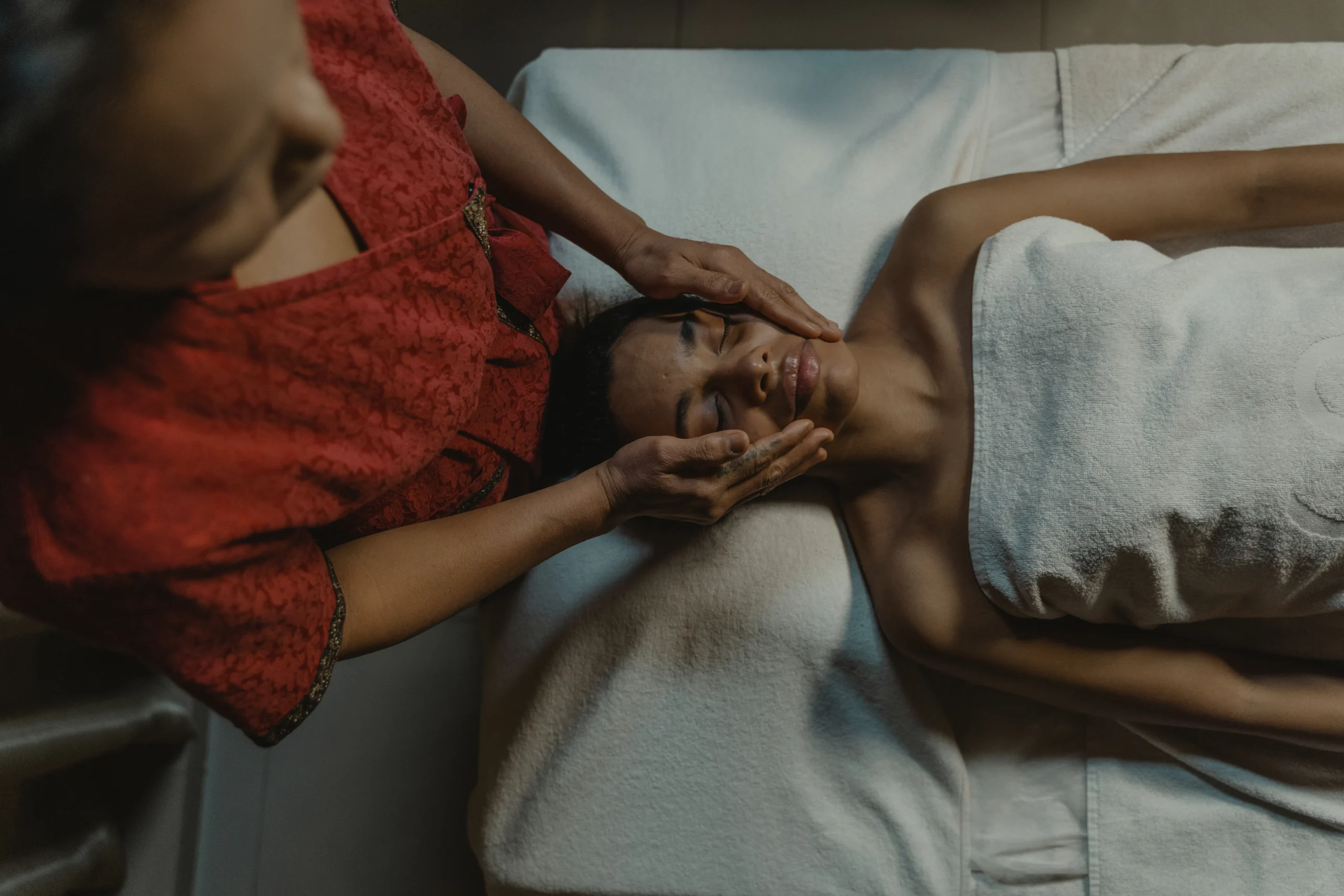 Overhead view of a beauty treatment in Amsterdam: facial massage.