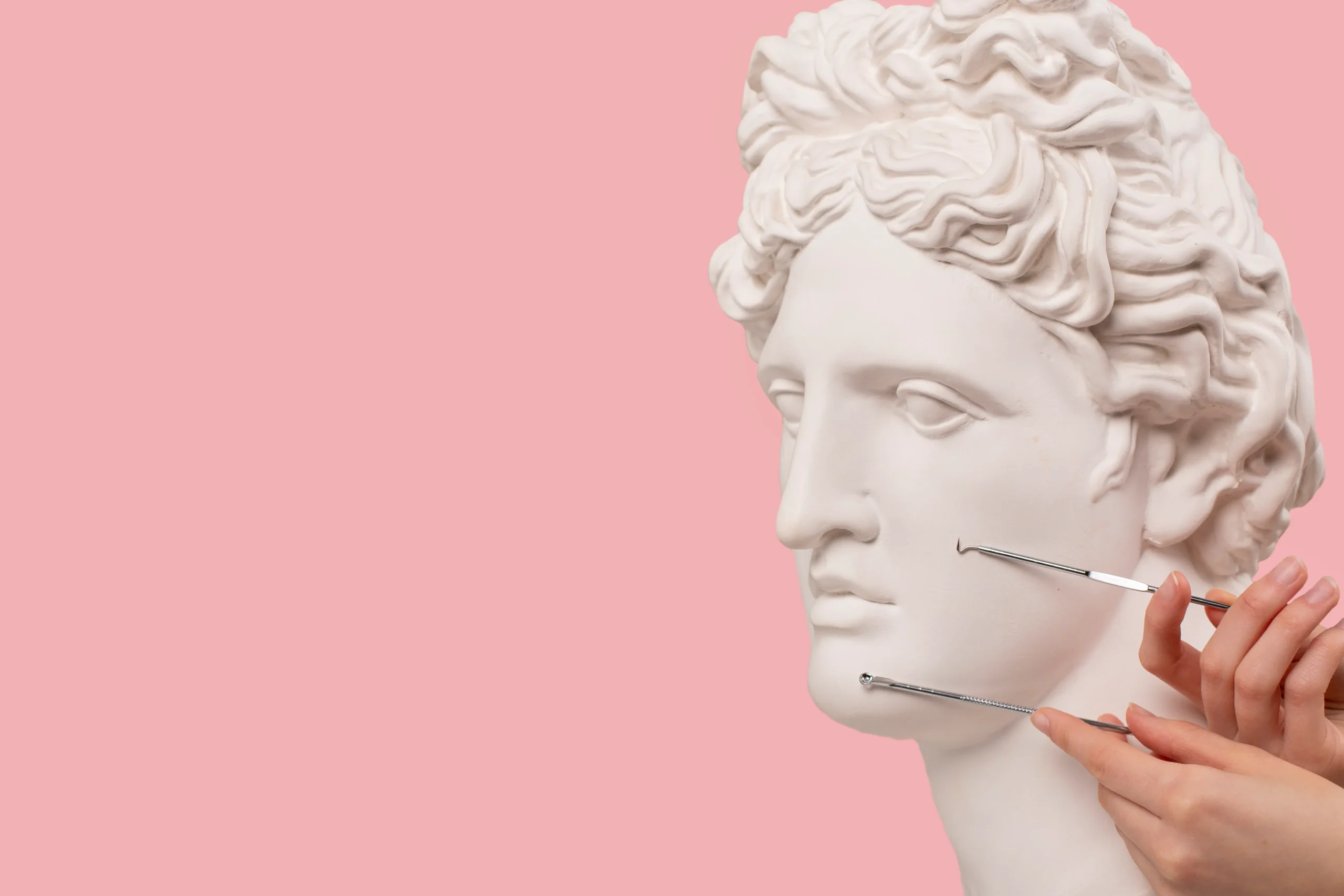 Sculpture face with acne extraction tools, conceptual for Amsterdam carbon peel myth busting.