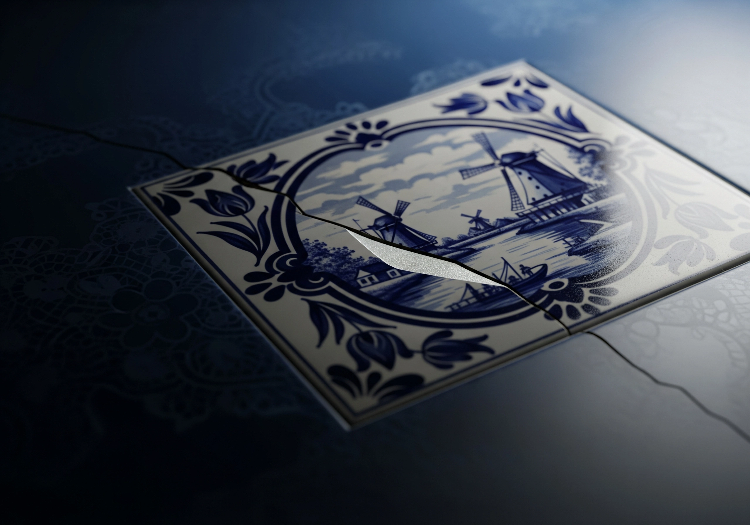 Cracked Delftware tile with a windmill scene in blue and white.